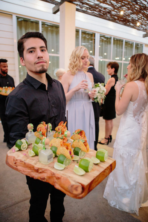 Solage outdoor wedding reception with mini tacos and tequila.