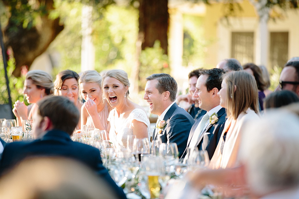 bride and groom laugh at father of bride speech at Beltane Ranch wedding