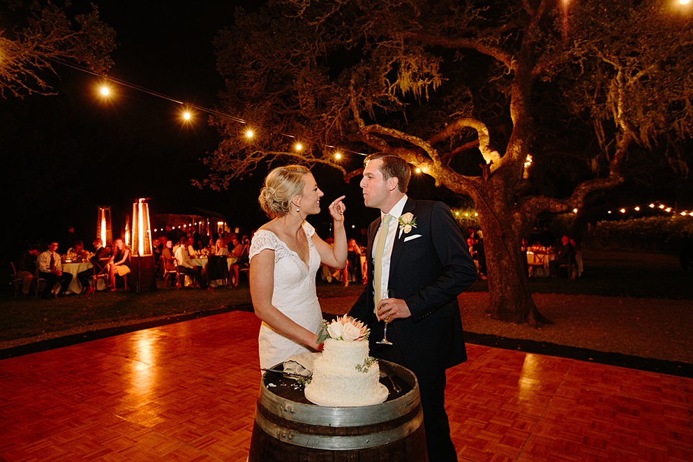 bride and groom eat cake at Beltane Ranch wedding