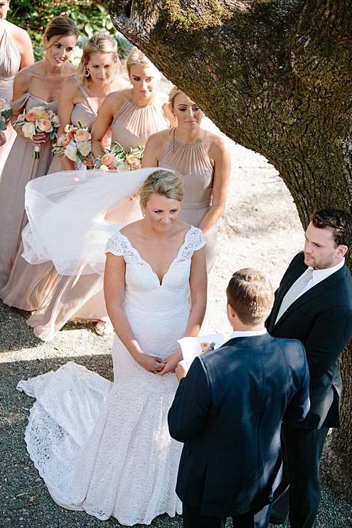 bride listens to her groom during Beltane Ranch wedding ceremony 