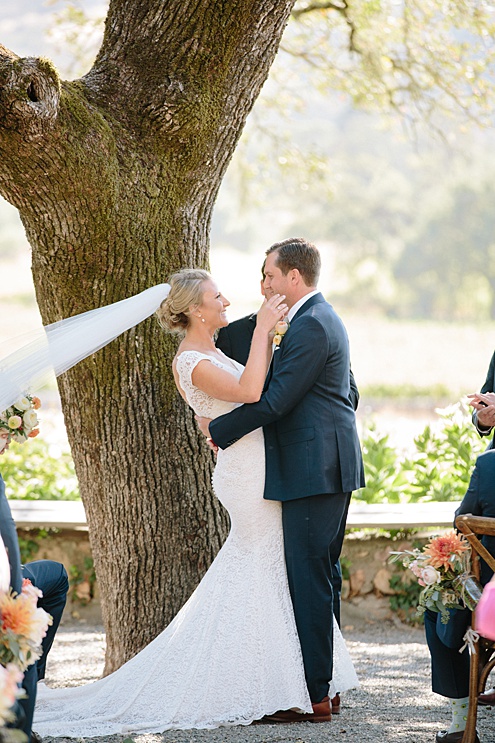 bride and groom kiss at Beltane Ranch wedding