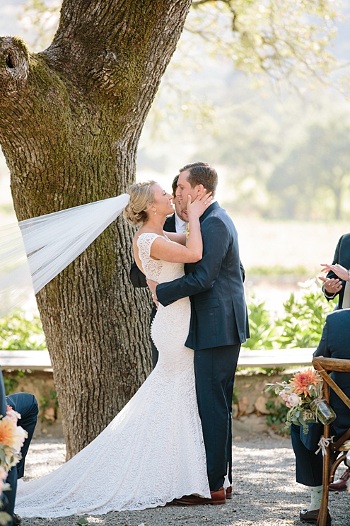 bride and groom embrace at Beltane Ranch wedding ceremony