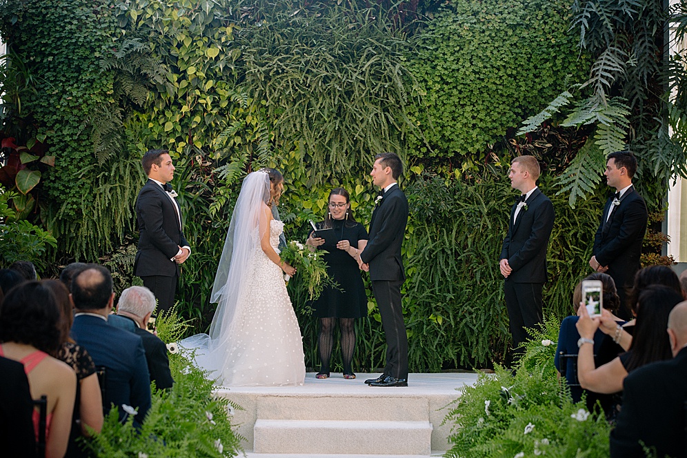 wedding ceremony starts at California Academy of Sciences Wedding by michelle walker photography