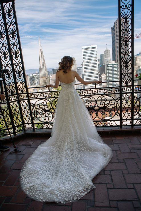 Bride looking out at san francisco before California Academy of Sciences Wedding by michelle walker photography