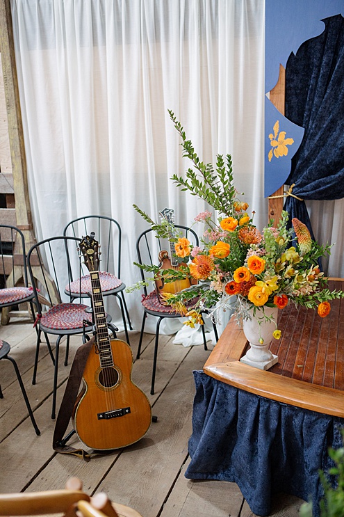 guitar and flowers for a barn wedding