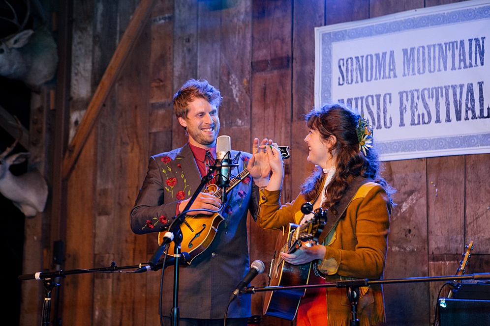 bride and groom performing their first song in a barn in Sonoma