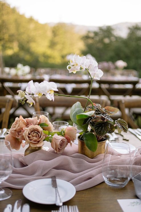 floral arrangment on table at calistoga ranch wedding by michelle walker photography