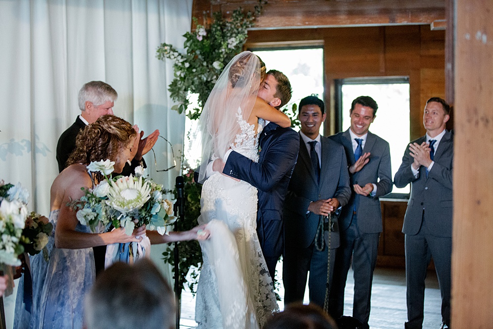 bride and groom kiss at wedding ceremony at Campovida winery wedding