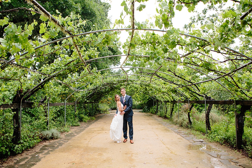 bride and groom amongst the vines at Campovida winery wedding by michelle walker photography