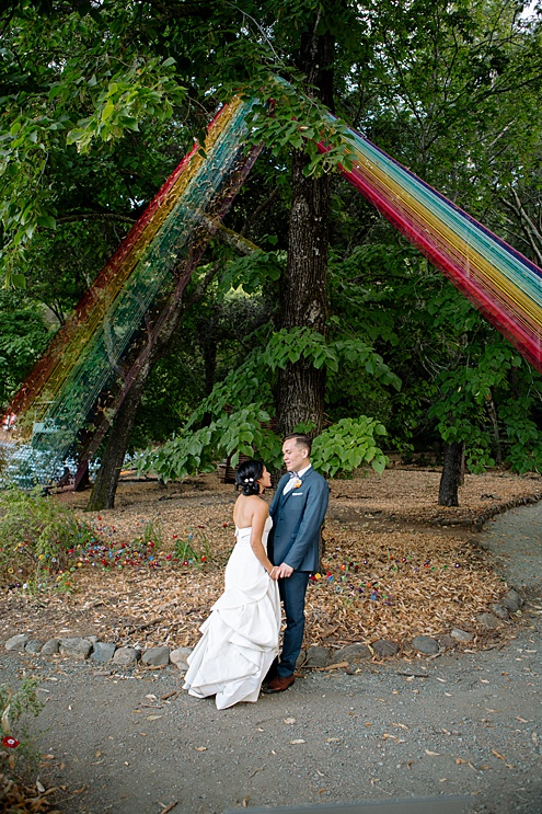 Bride and Groom under rainbow arch Villa Montalvo Wedding