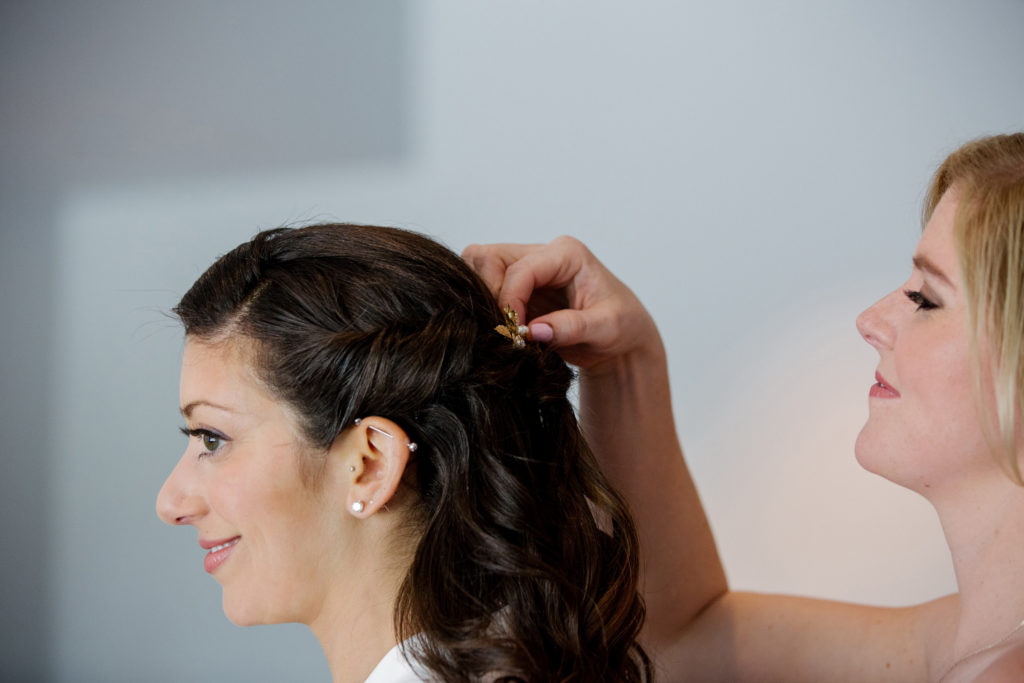 Bride getting hair done for her wedding.