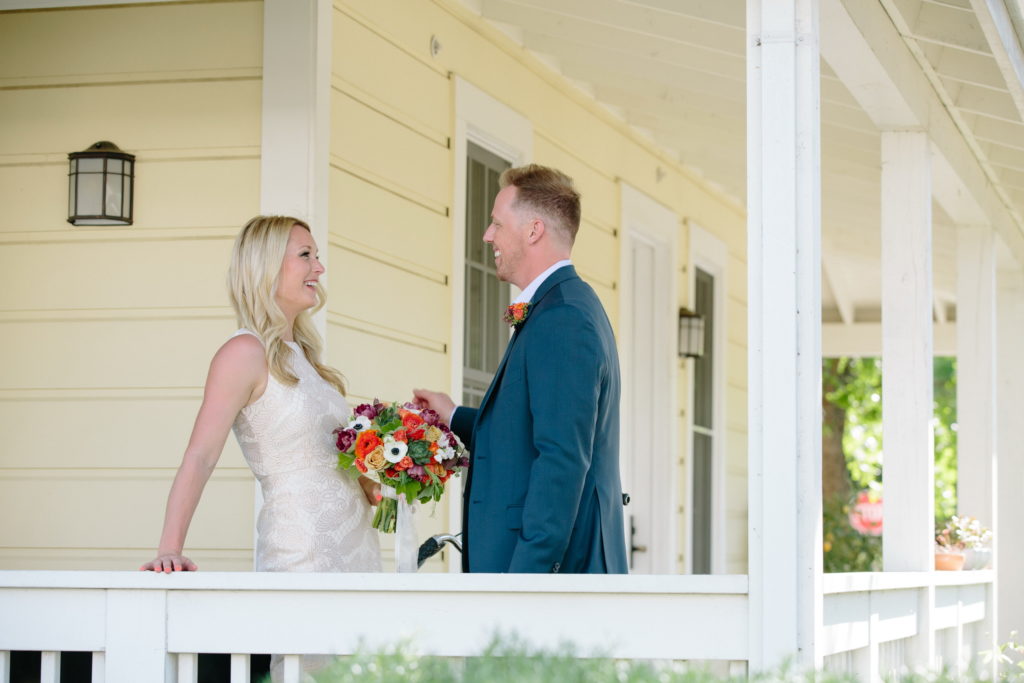 Bride and groom on the porch of the Hotel Yountville in Napa.